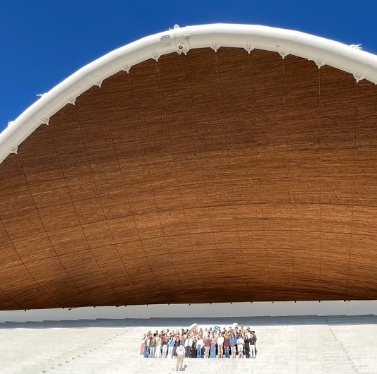 University singers performing at large open-air amphitheater at Tallinn Song Festival Grounds in Estonia