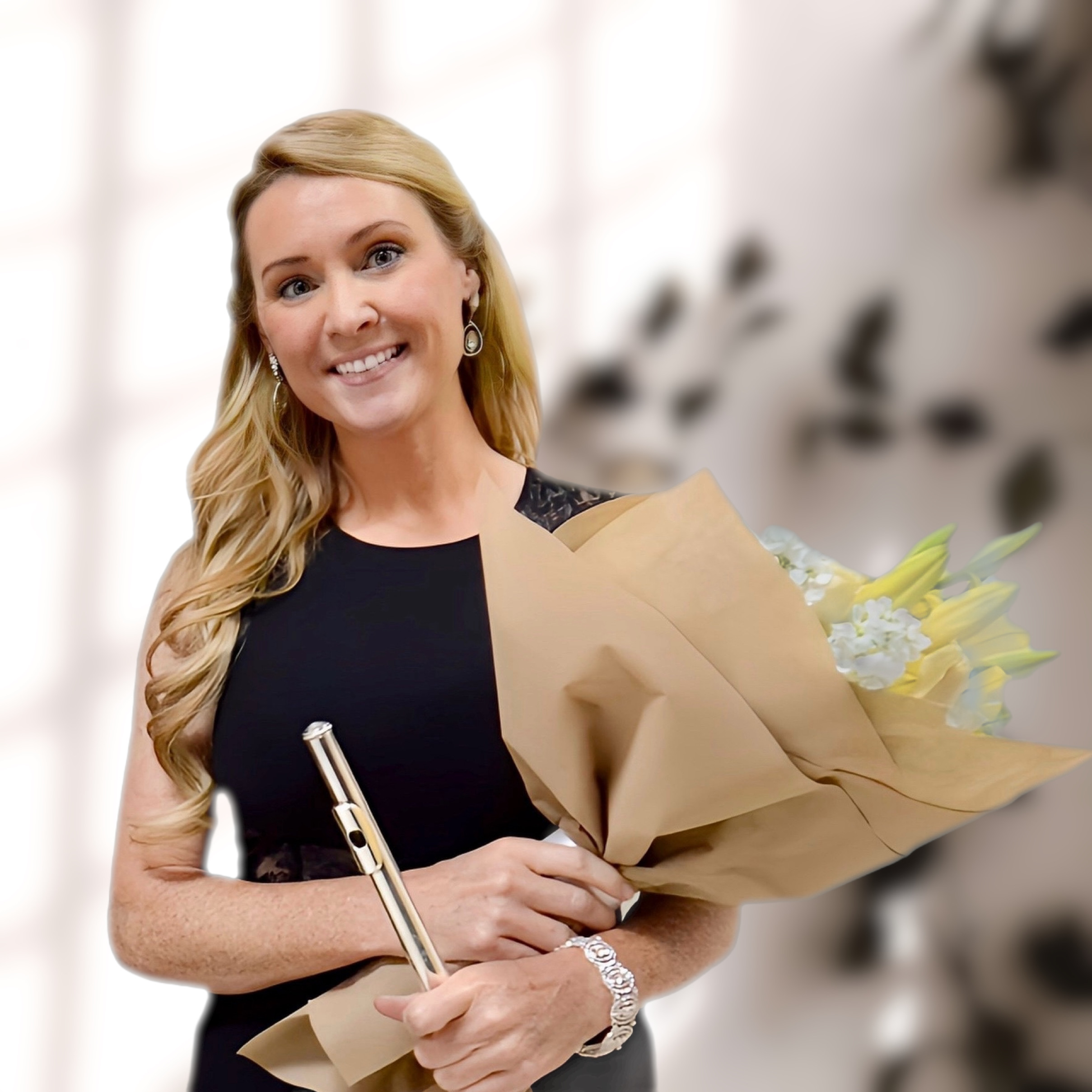 Krista Jobson with flute and flowers