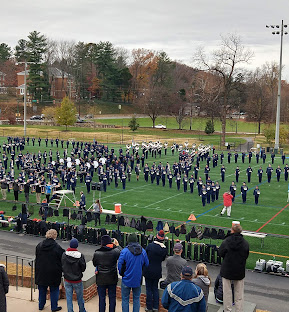 people watching the Cavalier Marching Band open rehearsal on Carr's Hill Field